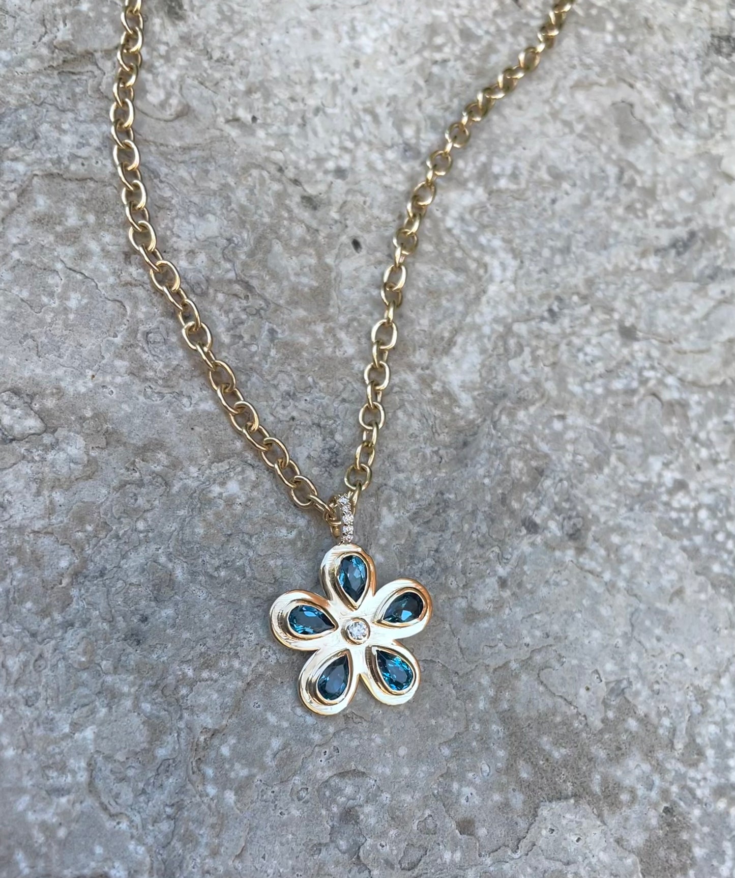 Blue Topaz and Diamond Flower Pendant